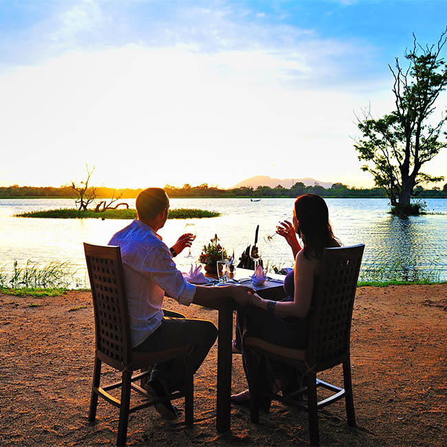 Outdoor dining at Cinnamon Lodge Habarana while enjoying the romantic sunset Outdoor dining at Cinnamon Lodge Habarana while enjoying the romantic sunset