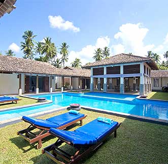 Swimming pool & day beds at Auraliya Resort