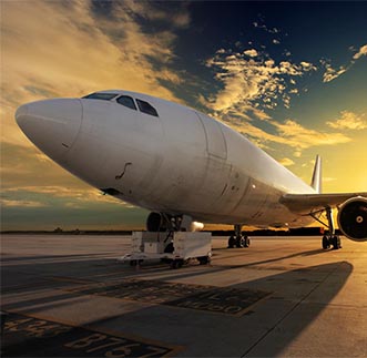 Close up view of an Aero plane landed on the ground at sunset