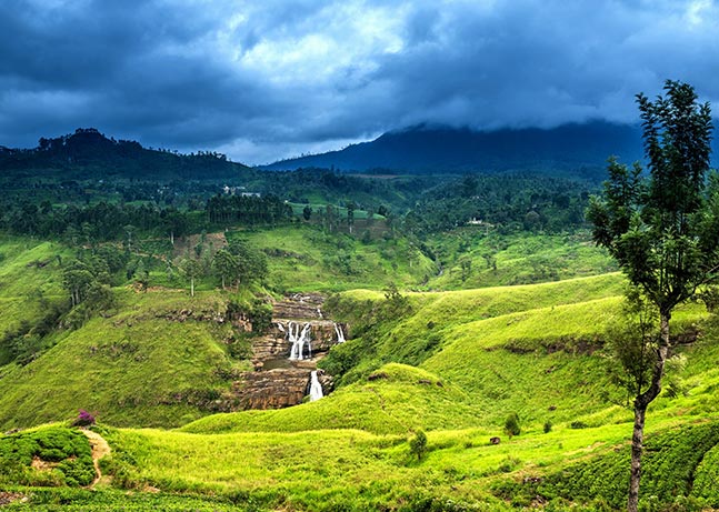 A beautiful waterfall, greenery and the clear blue sky