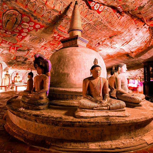 Vivid paintings & statues within the Dambulla Cave Temple