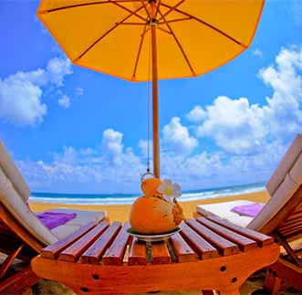 Day-beds by the beach at Aditya Resort 