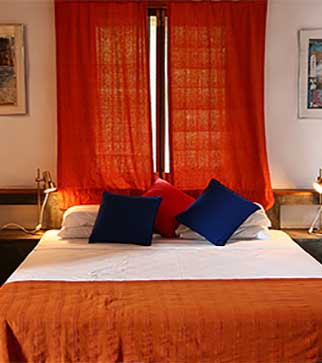 Cozy bedroom with orange and blue interior