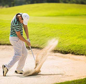 A tourist enjoying golf at a golf course in Sri Lanka